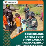 SATGAS RI-PNG KEWILAYAHAN YONIF 511/DY MEMBAGIKAN PAKAIAN KEPADA MASYARAKAT GUMBAN